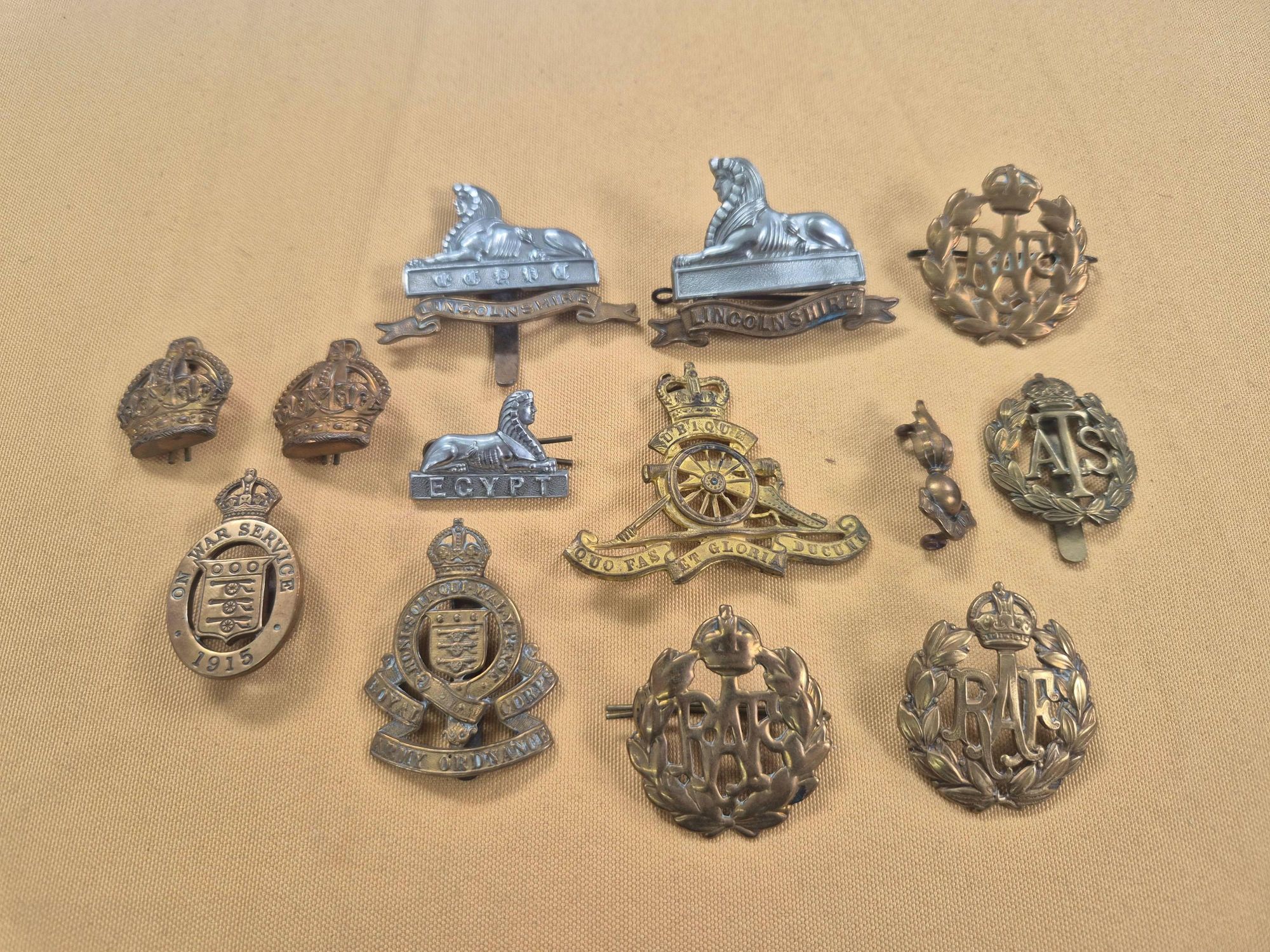 Assorted WWI and later military cap and uniform badges